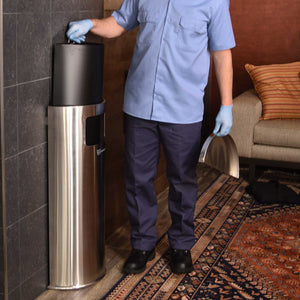 9 Gallon Stainless Steel Half-Round Side-Entry Trash Can being serviced by janitor